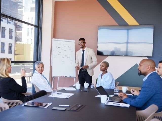 Group of people in discussion demonstrating ASQ's network with EDGE