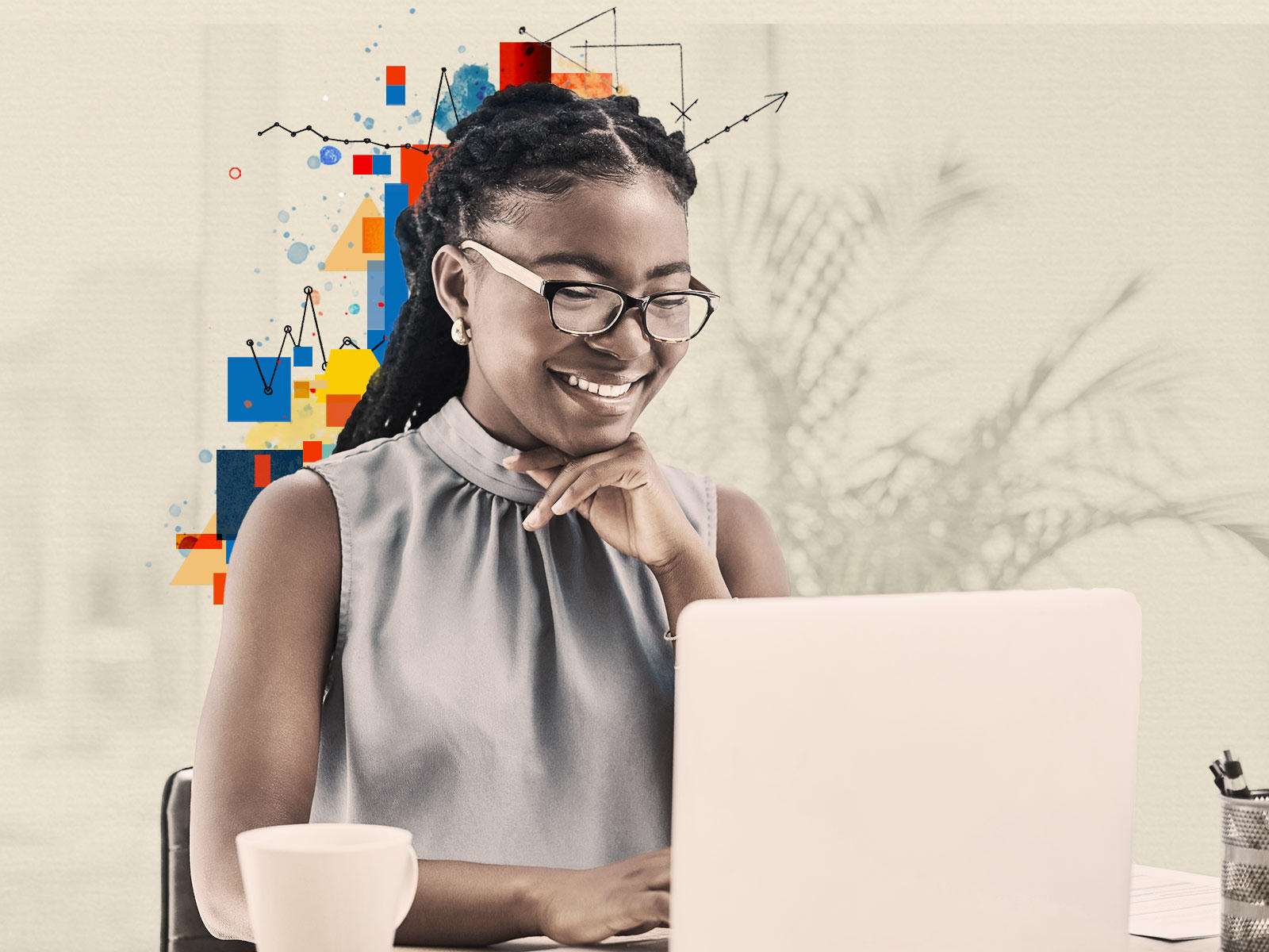 Woman smiling while viewing the Learning Library on a laptop