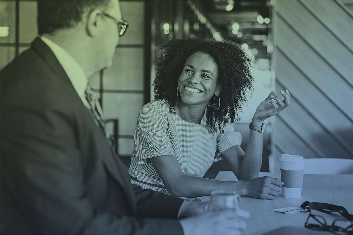 Woman and man at small conference table